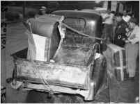 Police investigate the pickup truck where the body of Jeanette Reyman was found, 1947