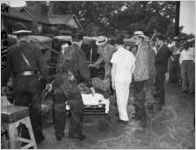 Police investigate the pickup truck where the body of Jeanette Reyman was found, 1947