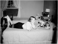 Teenage girl lying on bed
