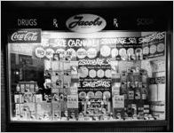 Jacobs Pharmacy window ("large economy size carnival")