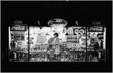 Jacobs Pharmacy window ("your savings grow")