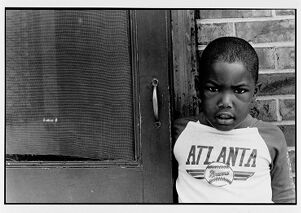 Brandon Thrasher in front of his East Lake apartment home, undated