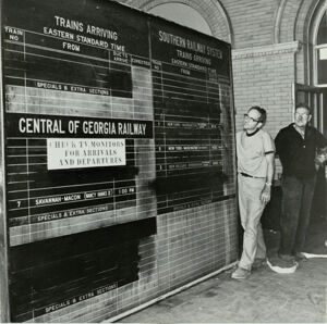 Rudy Ellis and Frank Murry Examine Old Train Schedules, July 22, 1971