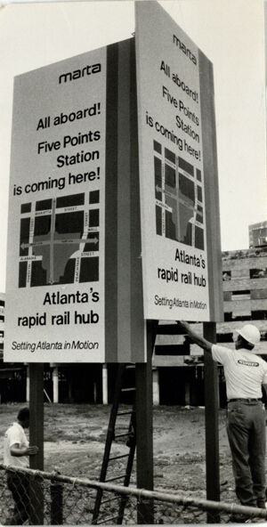 Workers Install a Sign at Alabama and Broad Streets In Downtown Atlanta, August 13, 1975