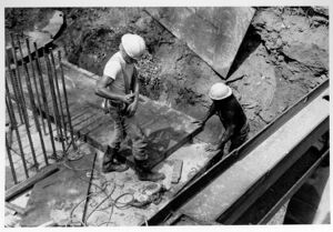 Stan Collins and James Cores build forms for the footing of bridge 8 at Goldsboro Park