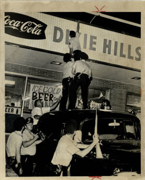 Atlanta Race Relations, Policemen Climb atop a Convenient Store during Dixie Hills Riot, June 20, 1967