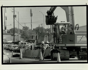 Workman Position Stone Barricades Down Center of Jimmy Carter Blvd. May 7, 1987
