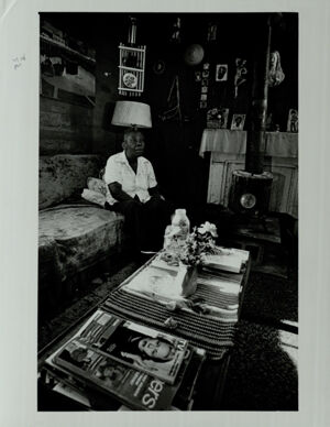 Atlanta Substandard Housing, Resident Sits in Living Room of Slum House in Tin City, March 1, 1981