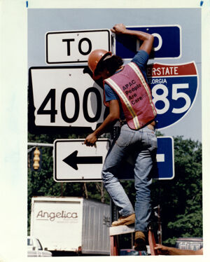 Roads and Highways, A Construction Worker Installs New Signs for the Glenridge Connector, June 21, 1992