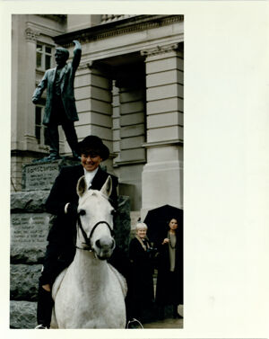 Diane Anderson and Her White Horse Popcorn Reenacting Eleanor Raoul's 1915 ride to the State Capitol, March 2, 1994