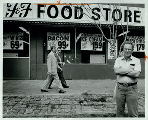 Phil Friedman, standing in front of his grocery store on Broad Street, September 2, 1982