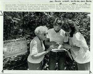 Residents Study Map That Shows the Property Next to their Neighborhood That a Developer had Requested Higher-Density Zoning, May 9, 1988