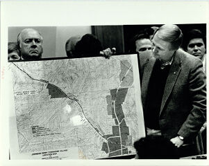 Zac Henderson displays a Chart at the Fulton County Commission Meeting