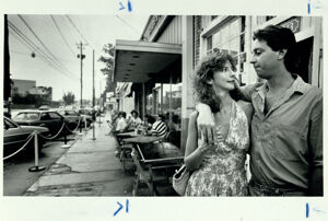 Dee Eubanks and Gregory Lockhart wait for a take-out order from Fellini's Pizza, August 9, 1987
