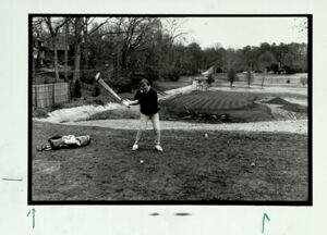Chris Dunn hits a shot at the Candler Park Golf Course, January 30, 1990