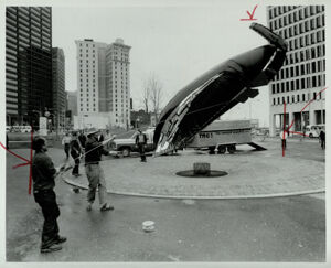 Pat Martelino launches his inflatable sculpture, with the help of Rob McDowell, in Central City Park, March 18, 1980