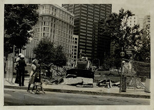 Sidewalks at Central City Park being taken apart by a bulldozer, undated