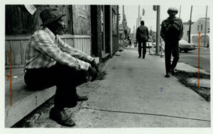 James Colbert sits at Piedmont and Auburn Avenues watching passerbys, October 16, 1983