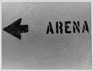 Painted wall sign pointing to the arena in Municipal Auditorium, January 31, 1979