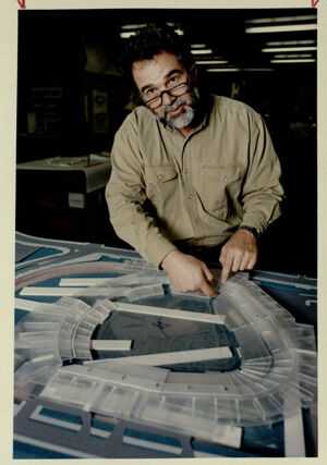 Ramon Giordano with his model of Olympic Stadium modifications for after the games are over, October 17, 1994