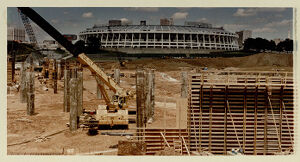 Construction of the Olympic Stadium with Atlanta's baseball stadium in the background, August 17, 1994