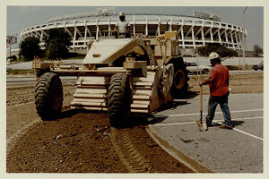 Colby Pomenter and Mike Bannister pulverize asphalt to prepare the Olympic Stadium construction site, July 30, 1993