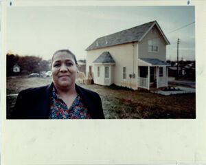Eunice Kimbro Stands in Front of Her New House in Vine City, Febuary 21, 1990