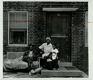 Louis and Mirtis Powell with their granddaughter Angela Olden outside their Techwood Homes apartment, undated