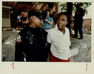 Officer Takes a Woman Into Custody at Techwood Homes, June 30 1990
