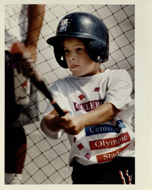 8-Year-Old Anna Blanton Takes A Swing With A Baseball Bat During A Sports Fair for Children, July 11, 1993