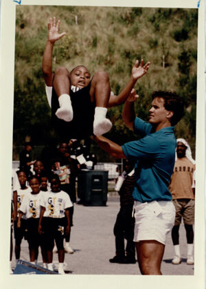 Pat Jones (right) Assists Larry Thomas, 11, in Gymnastics During a Sports Fair to Demonstrate Olympic Sports July 11, 1993