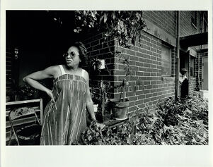 Gladys King stands outside her Perry Homes Residence
