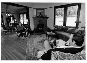 Ann Chandler talks with Jim Hillard inside his home
