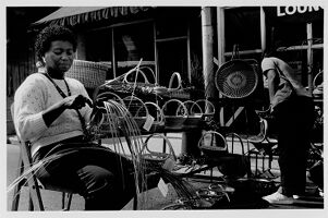 Mary Jackson weaving sweetgrass baskets for sale at the Much Ado About Midtown festival, undated