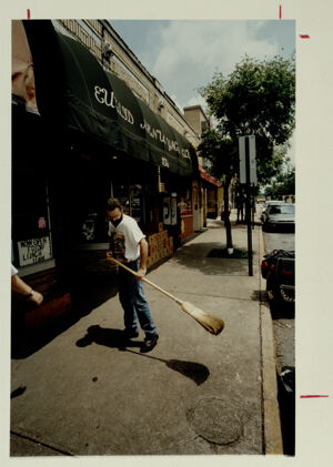 Don Hinamon sweeping in front of the Euclid Avenue Yacht Club, June 22, 1991