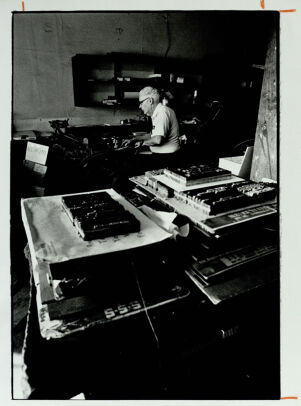 Ralph Cochran at his print shop in Kirkwood, January 13, 1983
