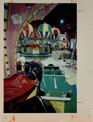 Marketing Manager, Leonard Soled with Zamperla Inc. Prepares one of several Amusement Rides at Their Display in the World Congress Center.