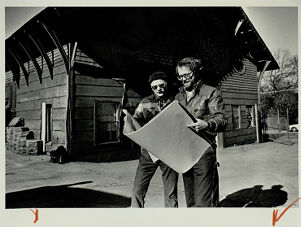 Bob Eberwein and Robert Denson look over blueprints for the Edgewood Railcar Barn, undated