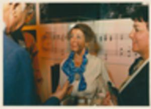 People speaking in exhibit