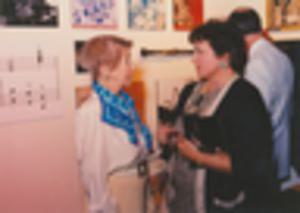 Women speaking in exhibit