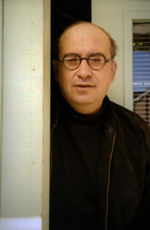 Arben Kumbaro, publicity photo for his play "Disremember Me," at 7 Stages Theatre, Atlanta, Georgia, January 26 - February 19, 2000.