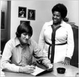 Unidentified staff or faculty member and student