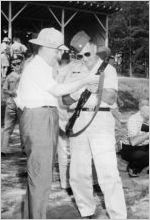 Dean Kenneth England and unknown man with rifle