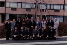 Group photo of officials that worked to negotiate the approval with the UAW and the Federal Trade Commission, 1984-04-27
