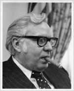 United States Secretary of Labor W. J. 'Bill' Usery, Jr. smoking a cigar, 1970s