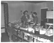 Mrs. Pharr and Family, basket-weaving handicraft project.