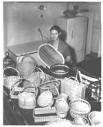 Mrs. Pharr and Family, basket-weaving handicraft project.