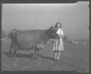 Sammie Henry with Grand Champion Jersey Cow.