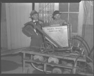 J. D. Lygart and June McNabb with sprayer on test block.