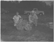 County agents and farmer. 4-H sweet potato project